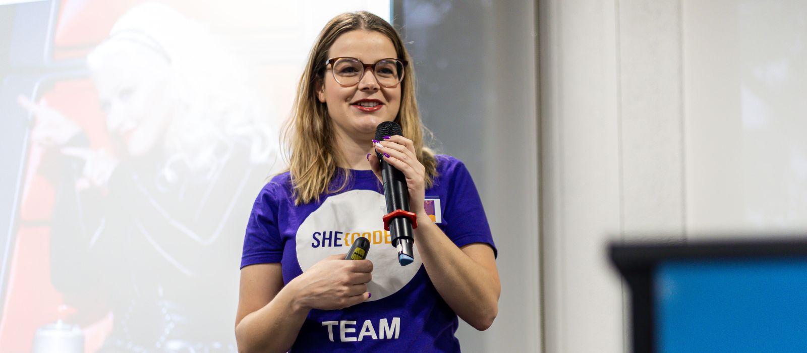 woman speaking into microphone