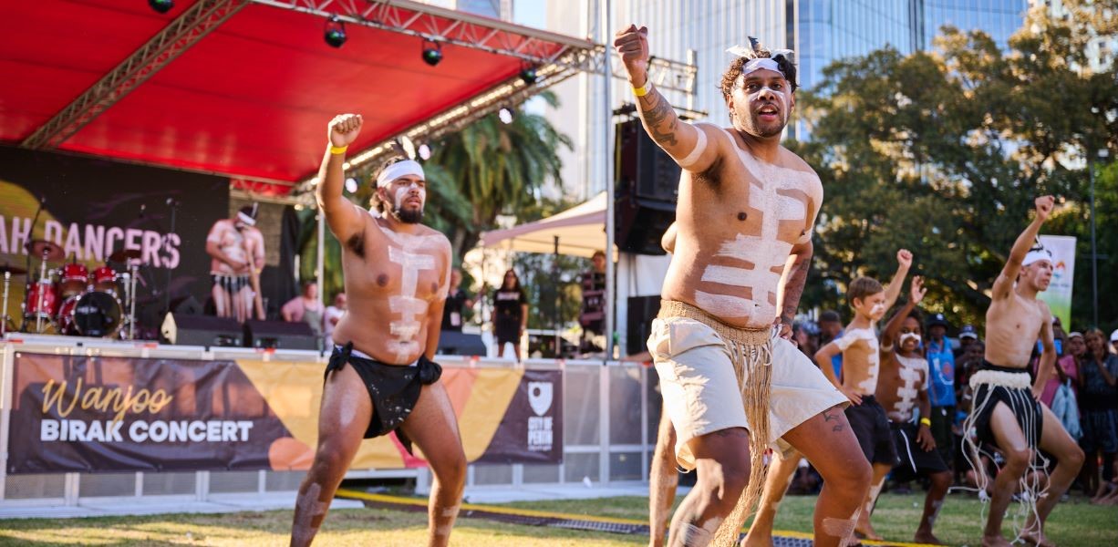 aboriginal dancers performing in front of stage