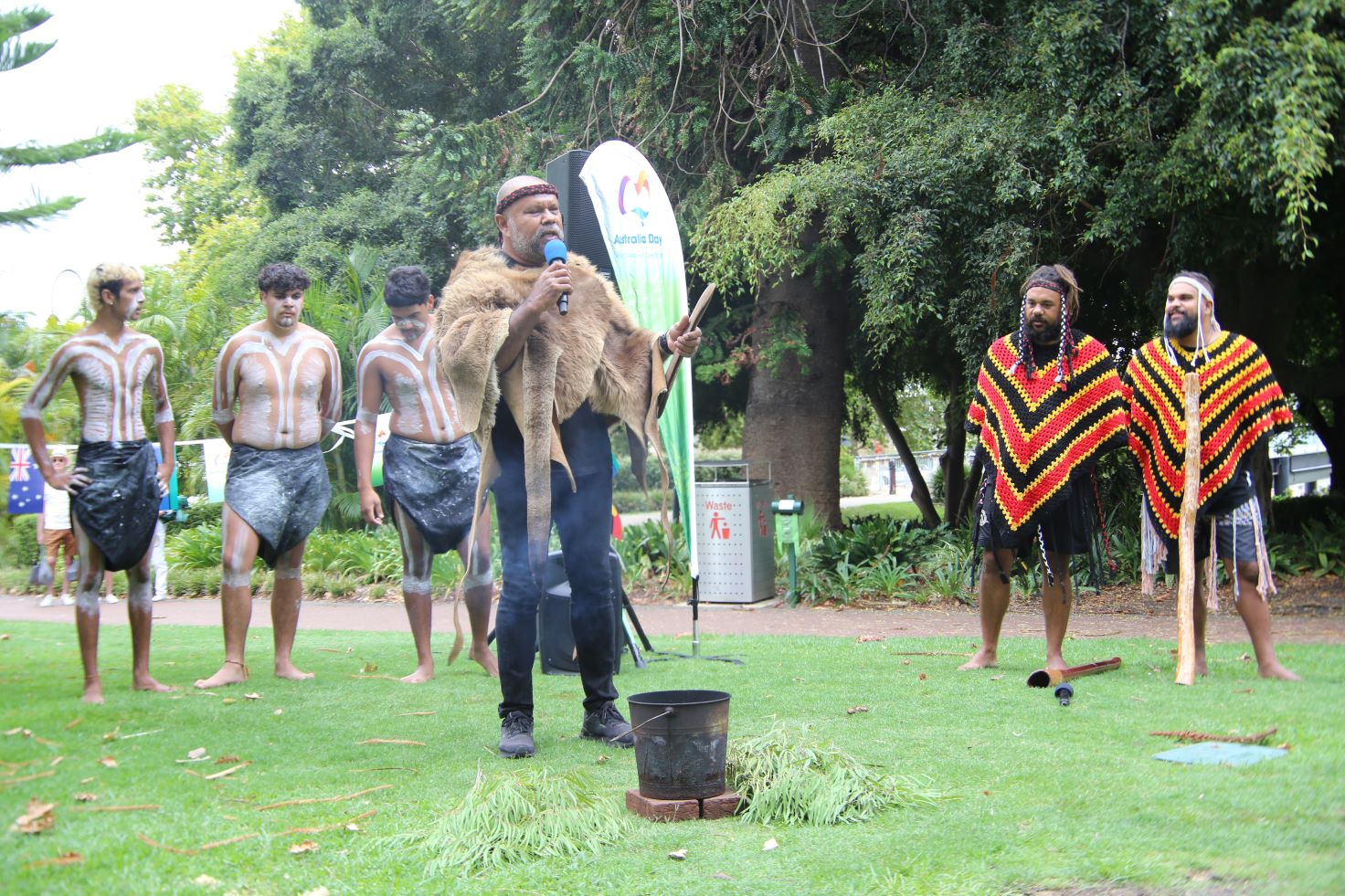 Barry Winmar delivers a Welcome to Country with dancers in background