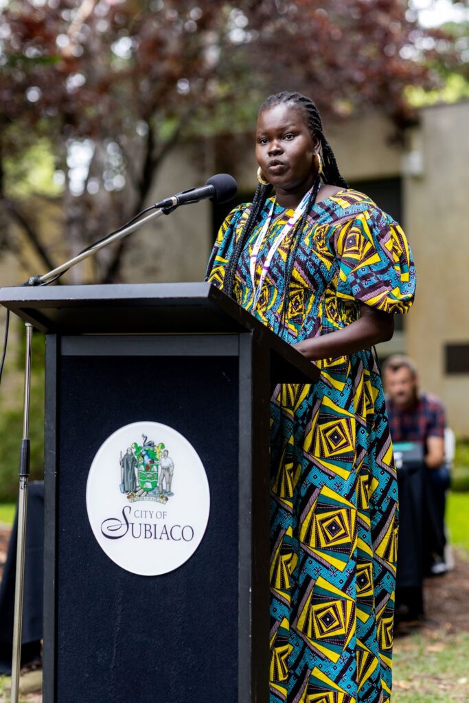 woman speaking at lectern