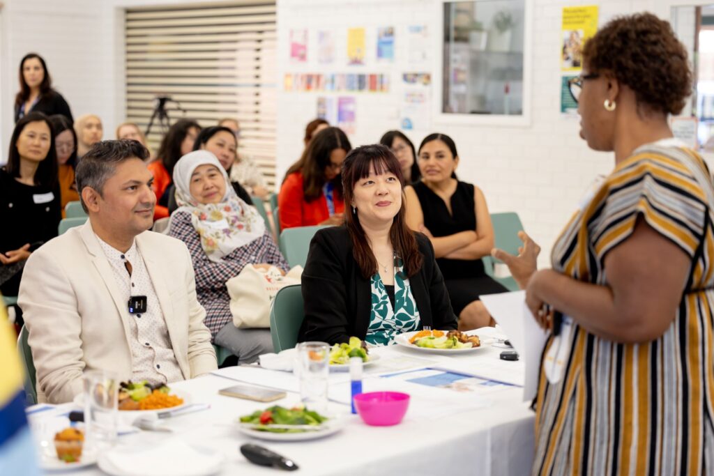 woman presenting to audience