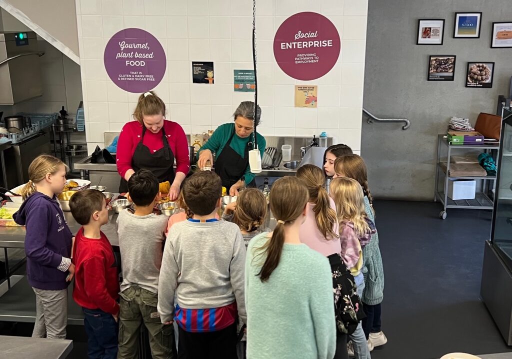 children watching cooking demonstration
