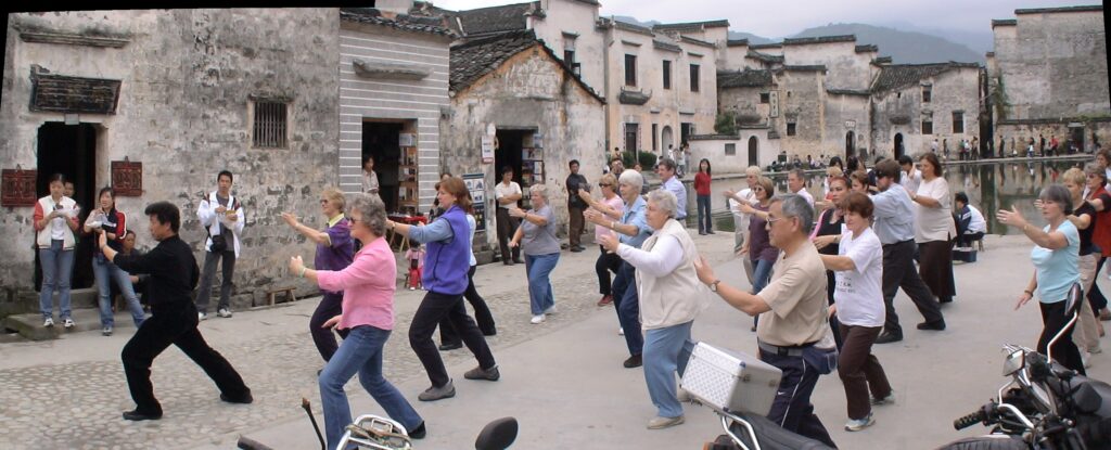 group of people doing tai chi in China