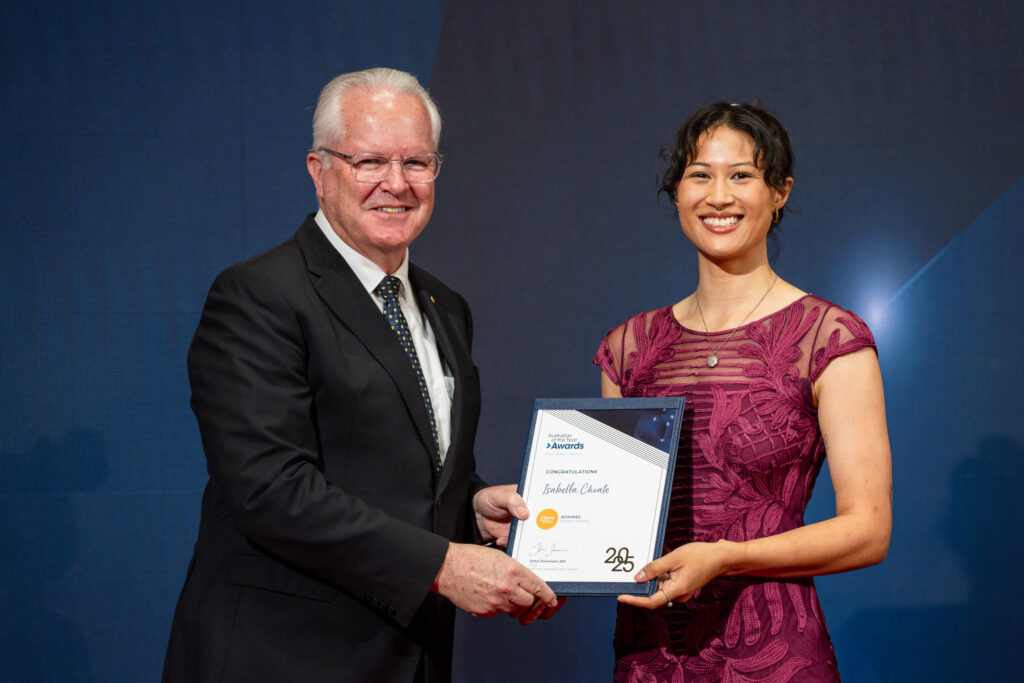 Governor of WA and Isabella Choate holding a certificate and smiling to camera