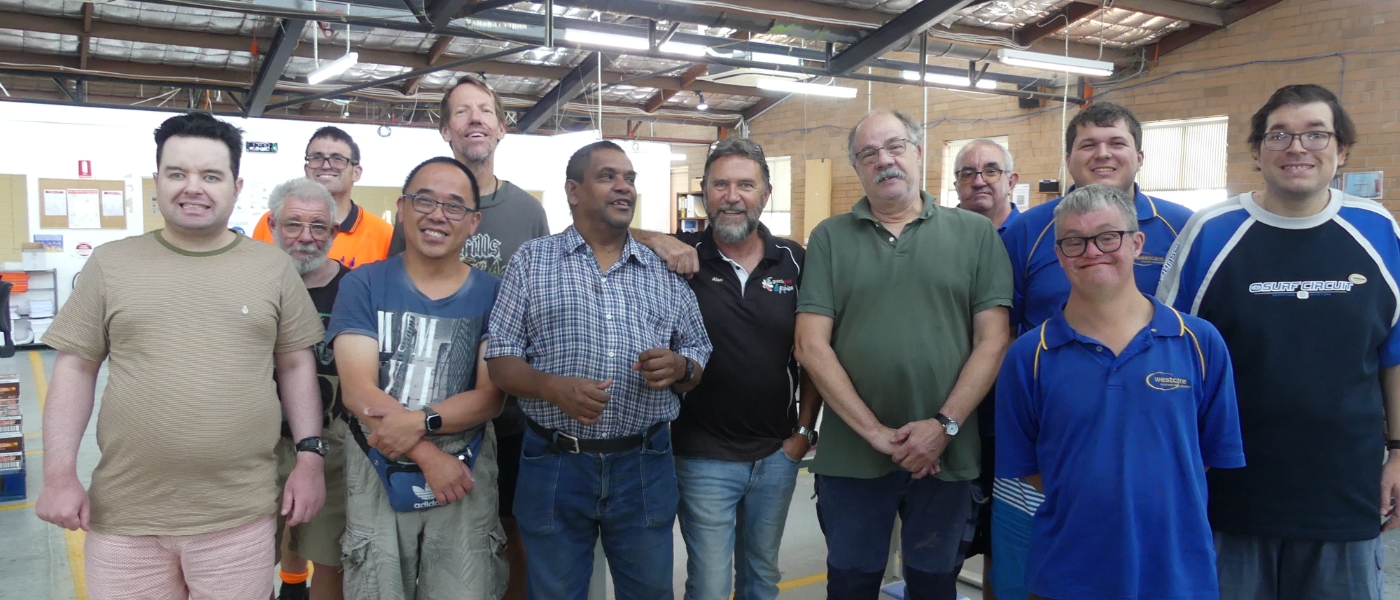 group of people smiling to camera