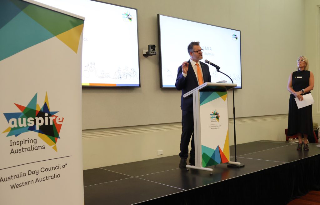 Dan Bull MLA standing and speaking at lectern