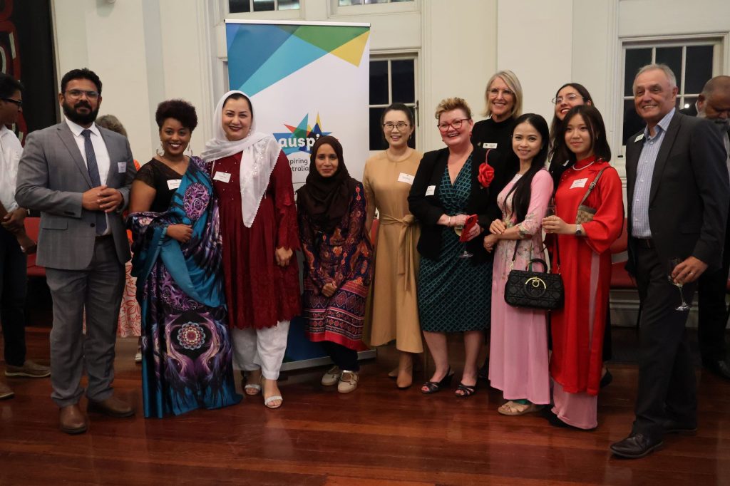 group of people standing together and smiling