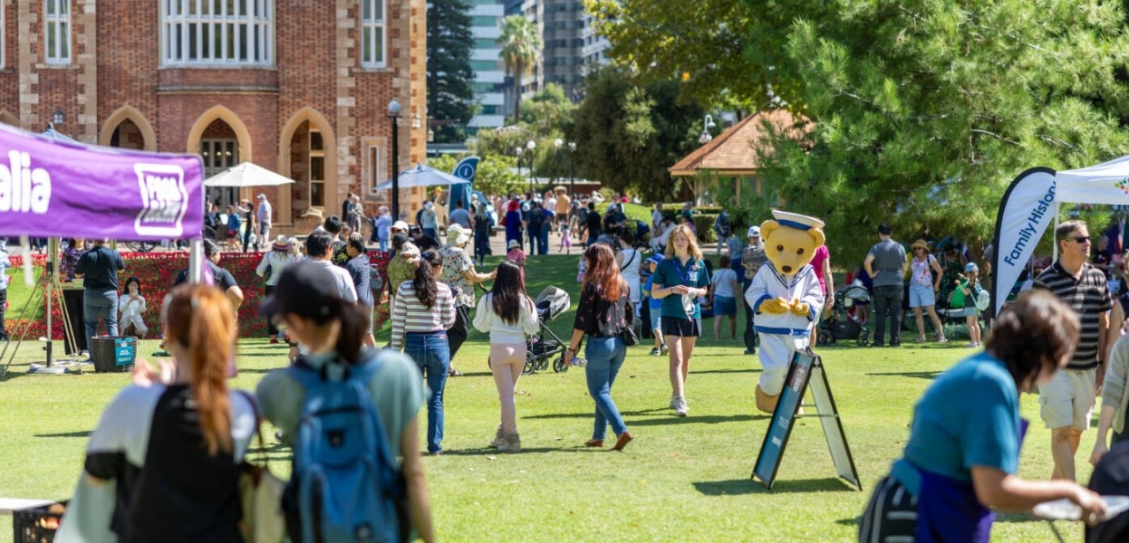 people walking across lawn of Government House