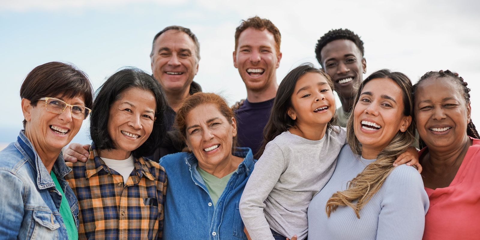 group of people smiling to camera
