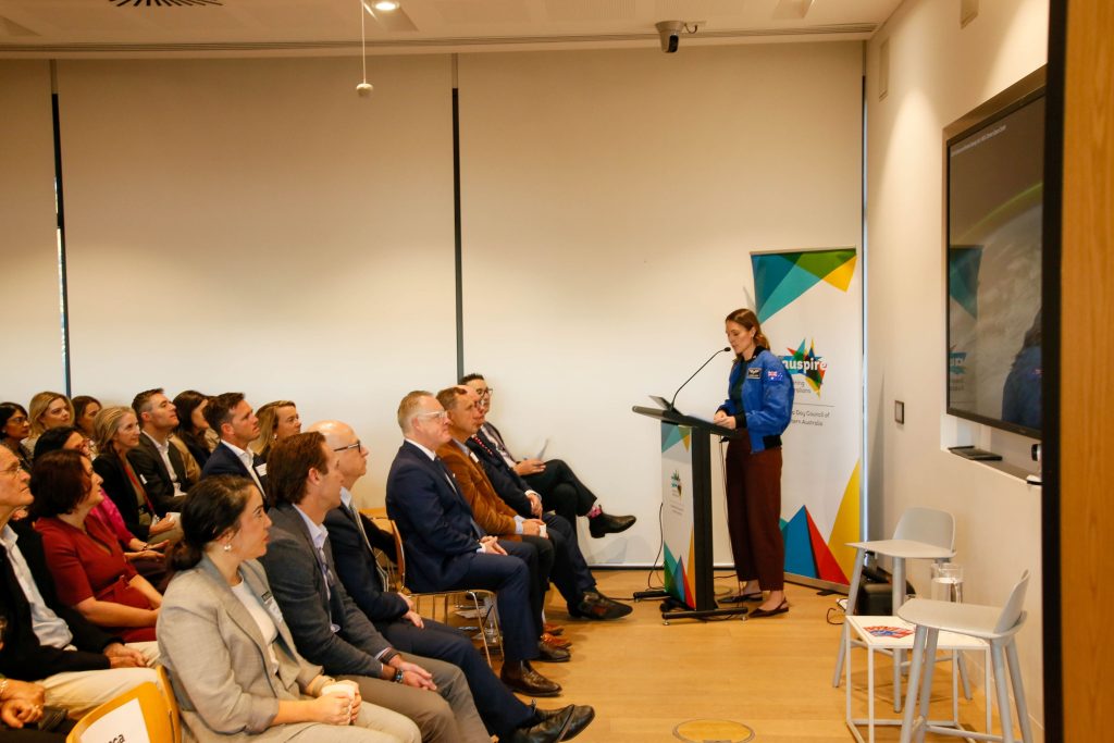 katherine bennell-pegg speaking to audience at lectern