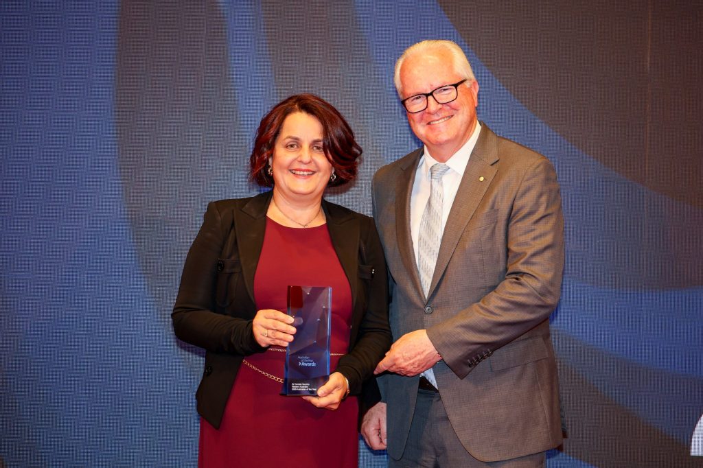 Daniela Vecchio holding her award next to Chris Dawson, Governor of Western Australia